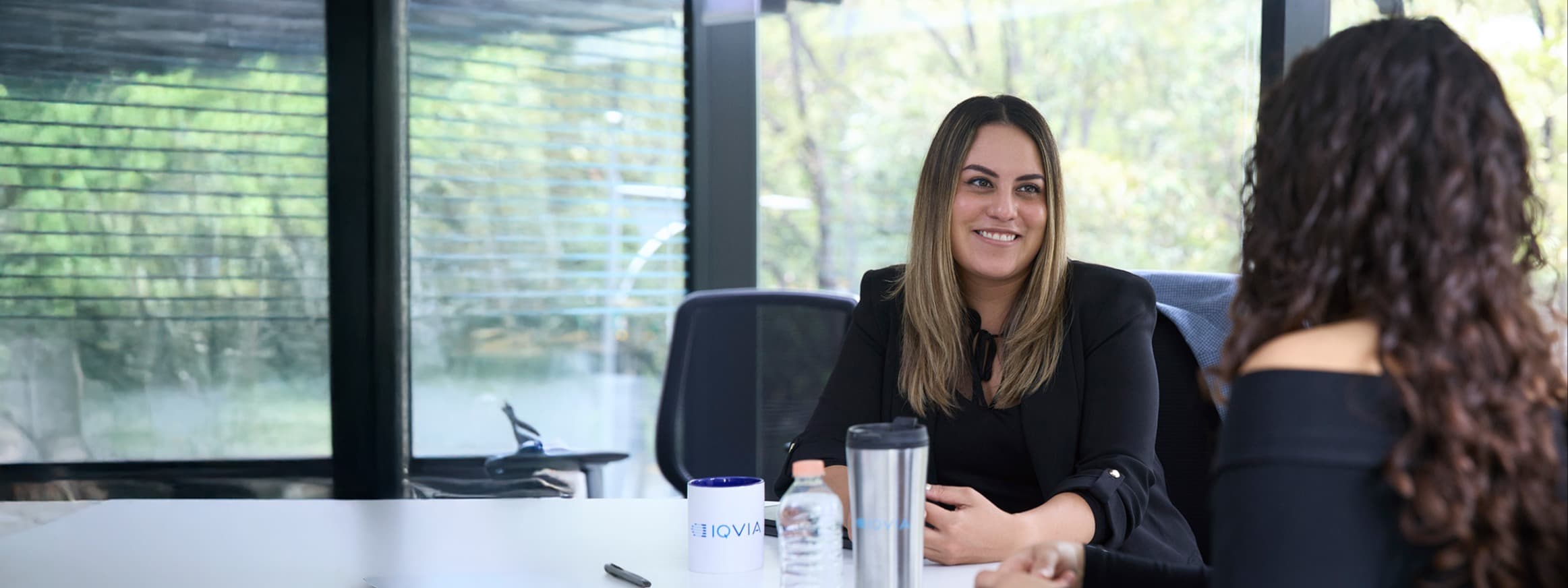 Women talking in workspace